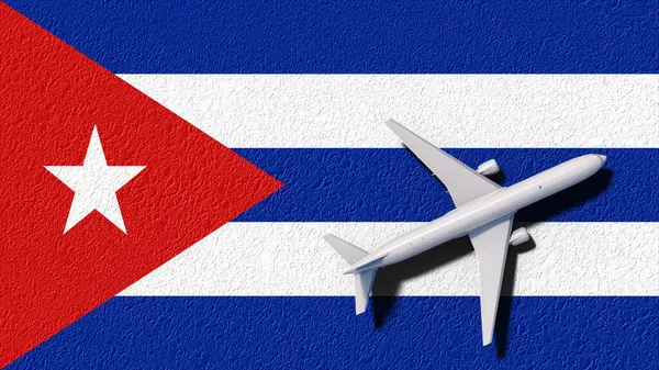 Egy repülőgép a kubai zászló felett, utazás szimbóluma.